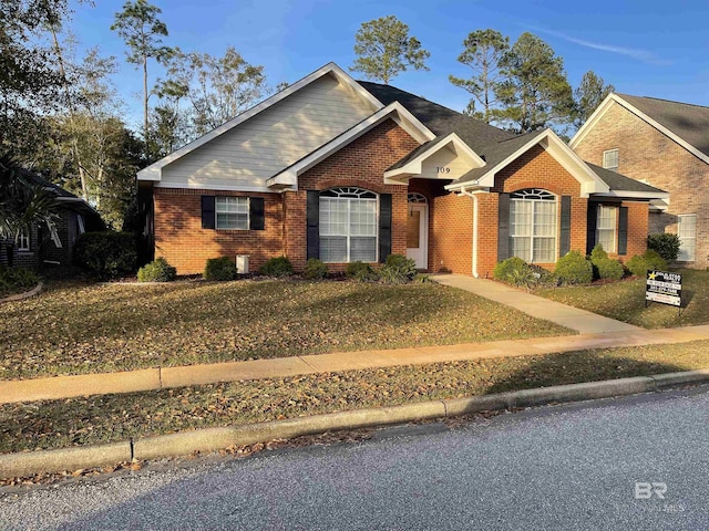 view of front of property with a front lawn