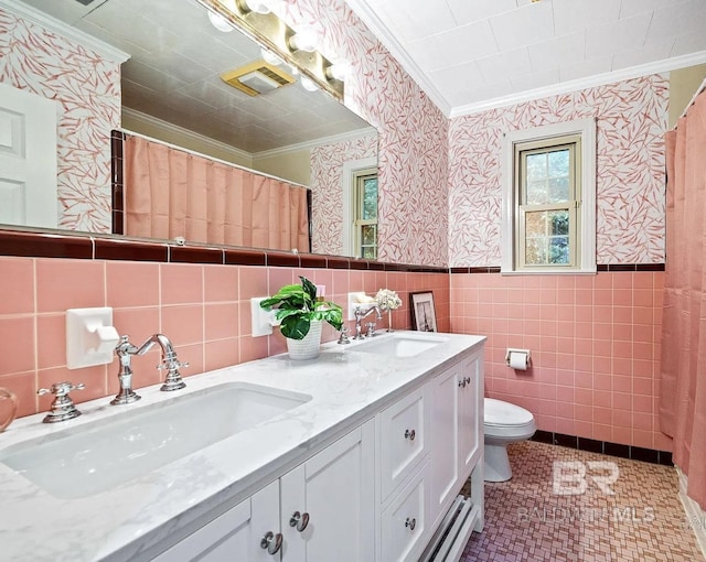 bathroom featuring toilet, vanity, tile patterned floors, and crown molding