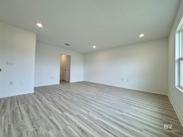 1036 Hayward Loop, Foley, AL 36535 - spare room featuring wood finished floors, recessed lighting, and baseboards