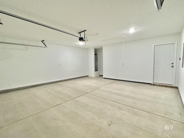 1036 Hayward Loop, Foley, AL 36535 - garage featuring a garage door opener and baseboards