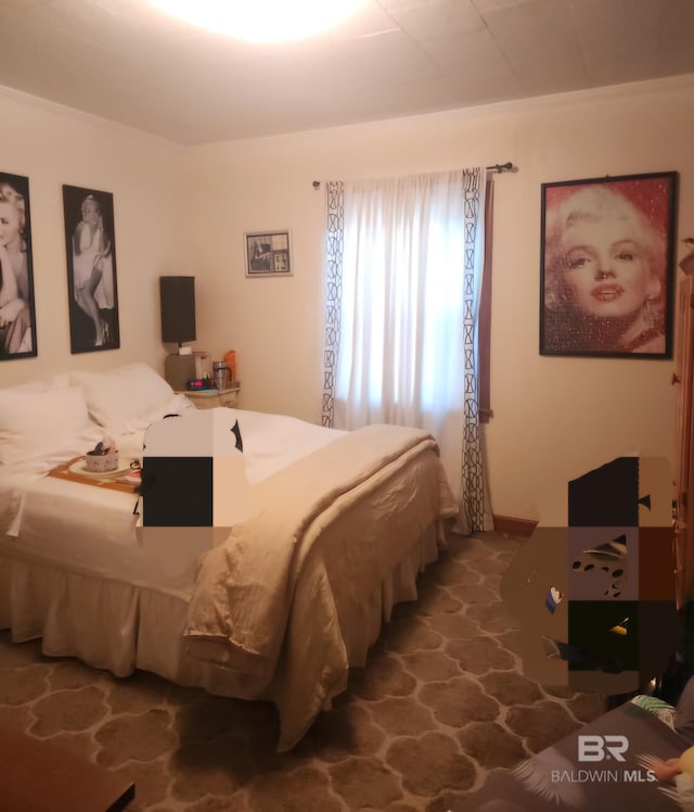 bedroom featuring stone finish flooring