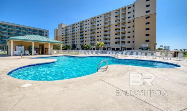 view of swimming pool with a patio