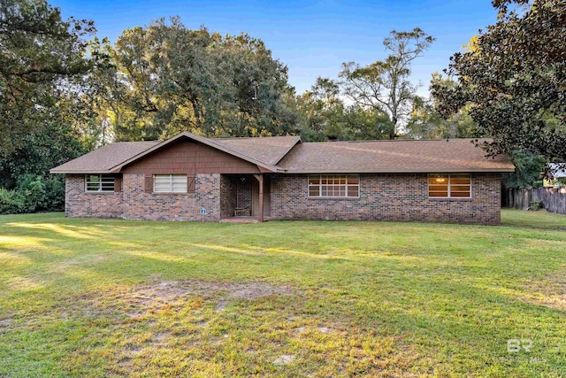 single story home with a front yard