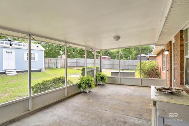 unfurnished sunroom featuring plenty of natural light and entry steps