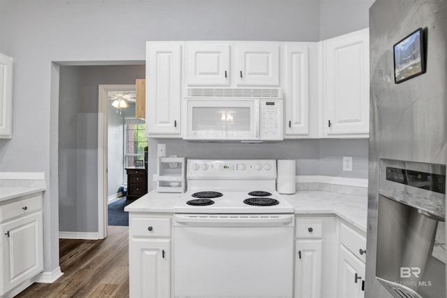 kitchen featuring white appliances, white cabinets, wood finished floors, and a ceiling fan