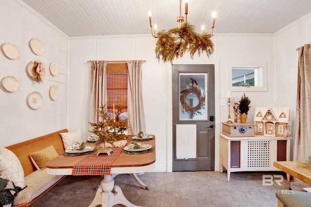 interior space featuring breakfast area, wood ceiling, and crown molding