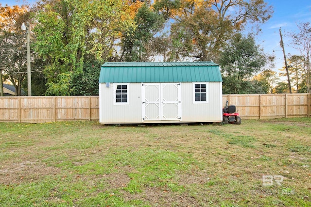 view of outdoor structure with a yard