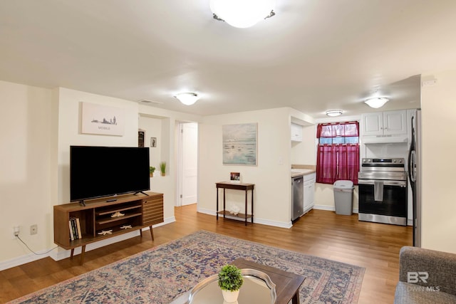 living room with dark hardwood / wood-style floors