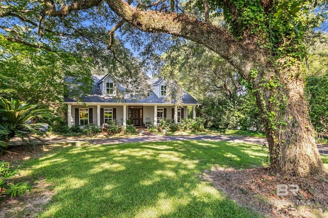 view of front of house featuring a front yard and covered porch