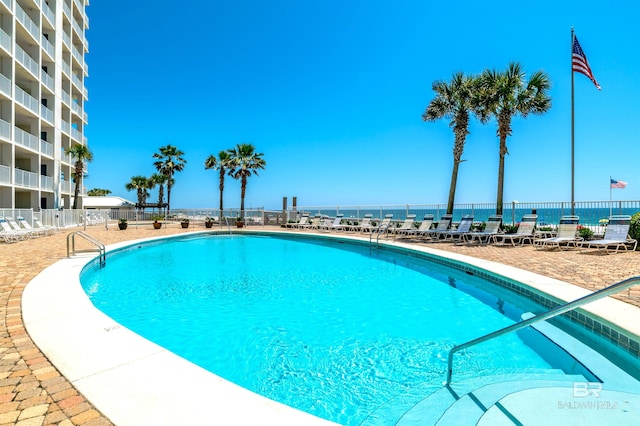 view of pool featuring fence