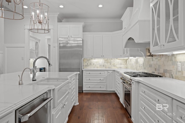 202 Paddle Creek Loop, Fairhope, AL 36532 - kitchen with stainless steel appliances, white cabinets, tasteful backsplash, ornamental molding, and glass insert cabinets