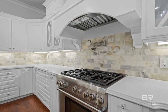 202 Paddle Creek Loop, Fairhope, AL 36532 - kitchen with high end stainless steel range, custom range hood, white cabinetry, glass insert cabinets, and crown molding