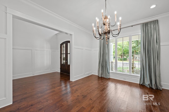 202 Paddle Creek Loop, Fairhope, AL 36532 - spare room featuring a chandelier, a decorative wall, wood finished floors, ornamental molding, and wainscoting