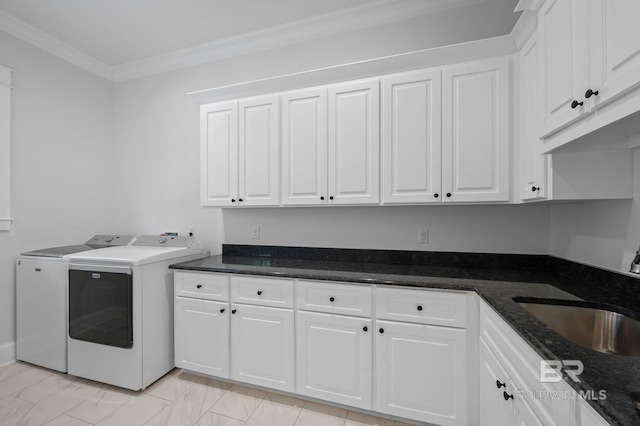 202 Paddle Creek Loop, Fairhope, AL 36532 - laundry room with washer and clothes dryer, cabinet space, ornamental molding, and light marble finish floors
