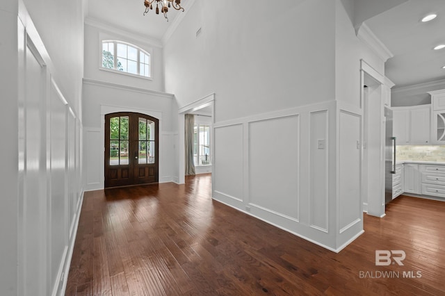 202 Paddle Creek Loop, Fairhope, AL 36532 - entryway featuring a decorative wall, ornamental molding, plenty of natural light, french doors, and dark wood-style floors
