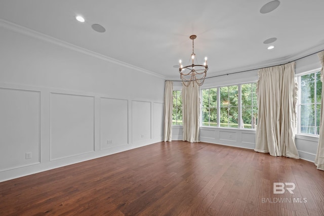 202 Paddle Creek Loop, Fairhope, AL 36532 - spare room featuring a decorative wall, a chandelier, ornamental molding, dark wood-type flooring, and recessed lighting