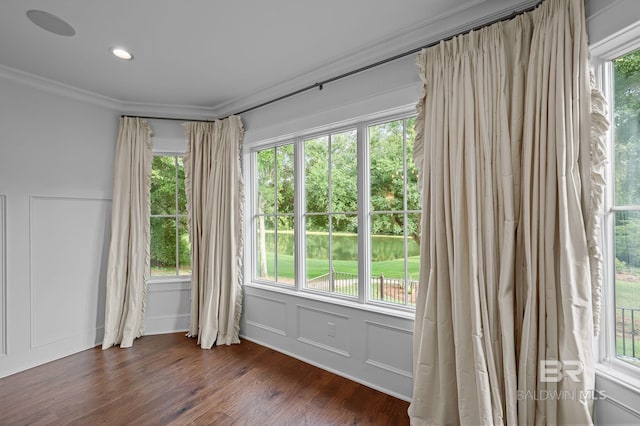 202 Paddle Creek Loop, Fairhope, AL 36532 - spare room with crown molding, healthy amount of natural light, dark wood-style floors, a decorative wall, and recessed lighting