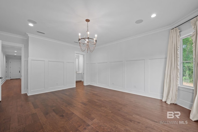 202 Paddle Creek Loop, Fairhope, AL 36532 - unfurnished dining area with a decorative wall, a chandelier, dark wood finished floors, ornamental molding, and wainscoting