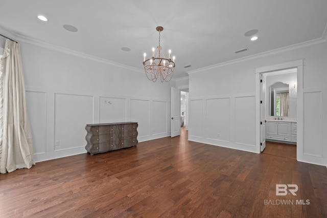 202 Paddle Creek Loop, Fairhope, AL 36532 - empty room with a decorative wall, a chandelier, crown molding, wood finished floors, and wainscoting