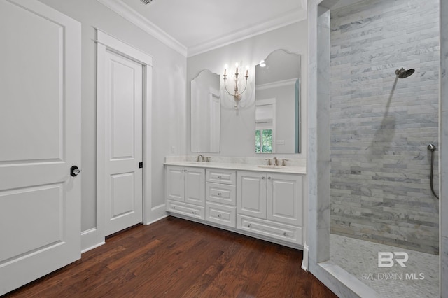 202 Paddle Creek Loop, Fairhope, AL 36532 - bathroom featuring crown molding, walk in shower, double vanity, and wood finished floors