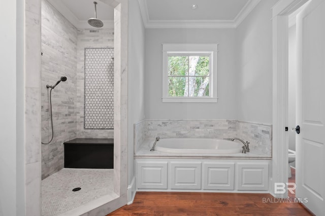 202 Paddle Creek Loop, Fairhope, AL 36532 - full bathroom featuring a garden tub, tiled shower, crown molding, wood finished floors, and toilet