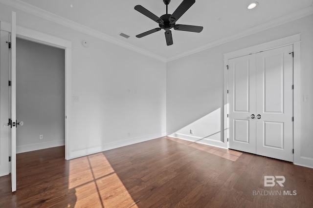 202 Paddle Creek Loop, Fairhope, AL 36532 - unfurnished bedroom with baseboards, wood finished floors, recessed lighting, crown molding, and a closet