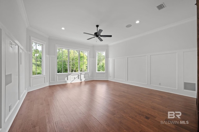 202 Paddle Creek Loop, Fairhope, AL 36532 - unfurnished living room with a decorative wall, ceiling fan, ornamental molding, wood finished floors, and wainscoting
