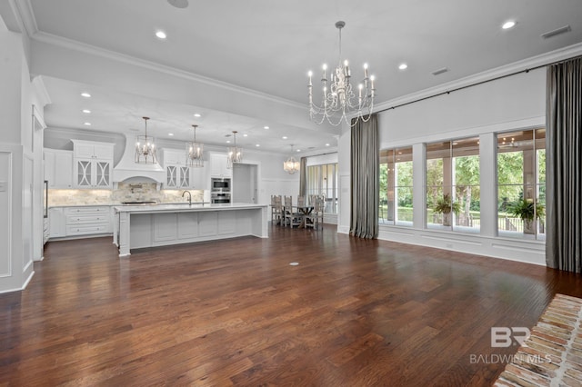 202 Paddle Creek Loop, Fairhope, AL 36532 - living area with a chandelier, ornamental molding, recessed lighting, and dark wood-style flooring