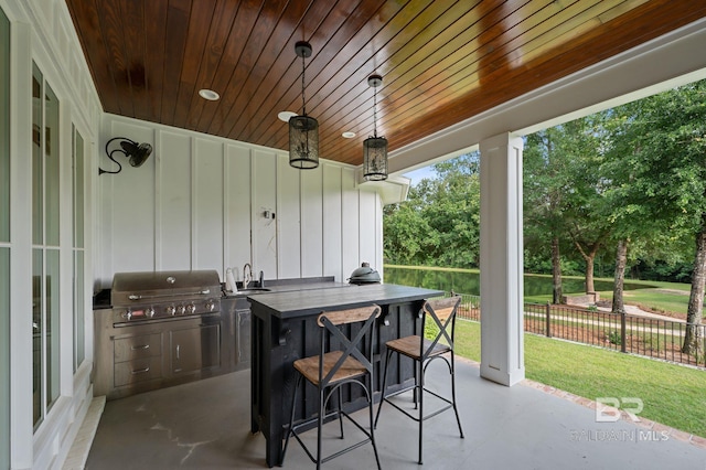 202 Paddle Creek Loop, Fairhope, AL 36532 - view of patio featuring a grill and view of scattered trees
