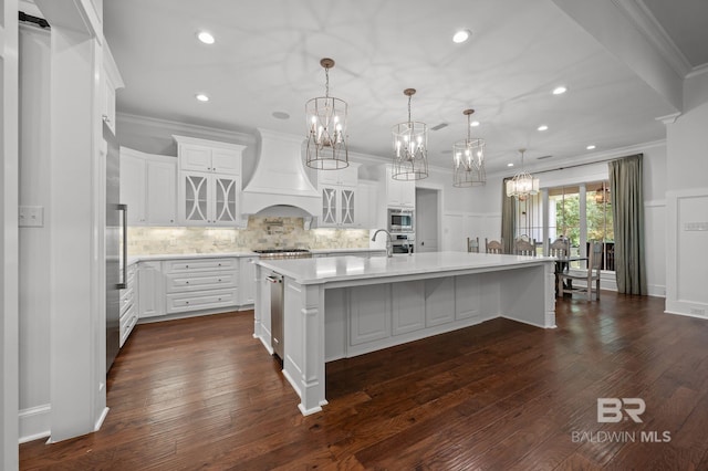202 Paddle Creek Loop, Fairhope, AL 36532 - kitchen featuring a chandelier, custom range hood, stainless steel appliances, crown molding, and light countertops