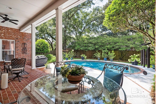 view of pool with a patio and ceiling fan