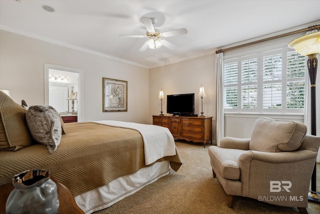 carpeted bedroom featuring ornamental molding, ensuite bathroom, and ceiling fan