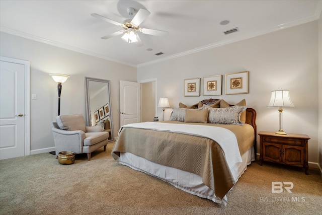 bedroom with ornamental molding, ceiling fan, and carpet flooring