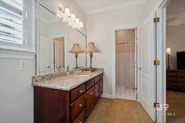 bathroom featuring crown molding and vanity