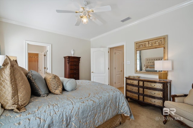 carpeted bedroom with crown molding, ceiling fan, and ensuite bathroom