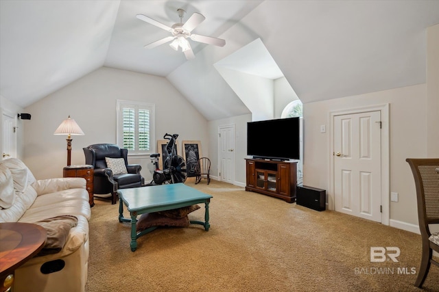 carpeted living room with vaulted ceiling and ceiling fan