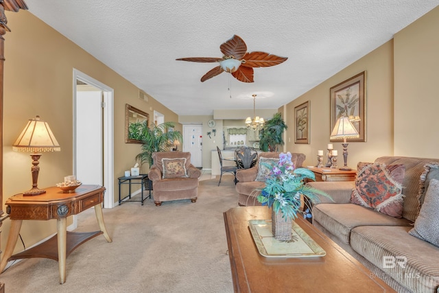 24522 Perdido Beach Blvd Unit 5617, Orange Beach, AL 36561 - living area with light carpet, a chandelier, a ceiling fan, and a textured ceiling