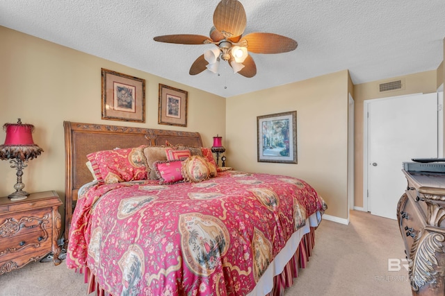 24522 Perdido Beach Blvd Unit 5617, Orange Beach, AL 36561 - carpeted bedroom featuring a textured ceiling and ceiling fan