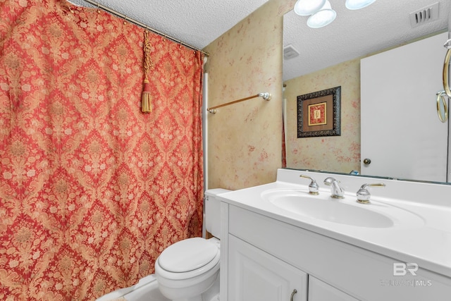 24522 Perdido Beach Blvd Unit 5617, Orange Beach, AL 36561 - full bath featuring a textured ceiling, wallpapered walls, vanity, and a shower with curtain