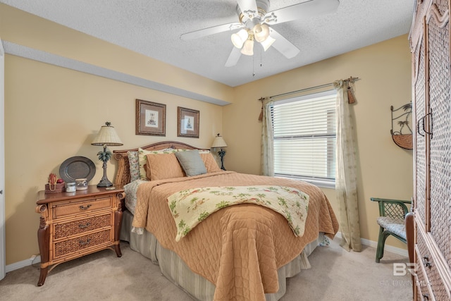 24522 Perdido Beach Blvd Unit 5617, Orange Beach, AL 36561 - bedroom featuring light carpet, ceiling fan, and a textured ceiling