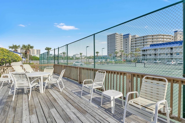 24522 Perdido Beach Blvd Unit 5617, Orange Beach, AL 36561 - wooden terrace featuring a tennis court