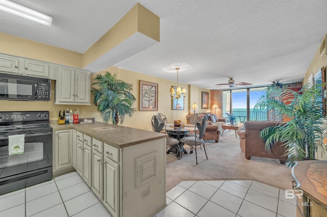 24522 Perdido Beach Blvd Unit 5617, Orange Beach, AL 36561 - kitchen featuring black appliances, a peninsula, a textured ceiling, light colored carpet, and ceiling fan