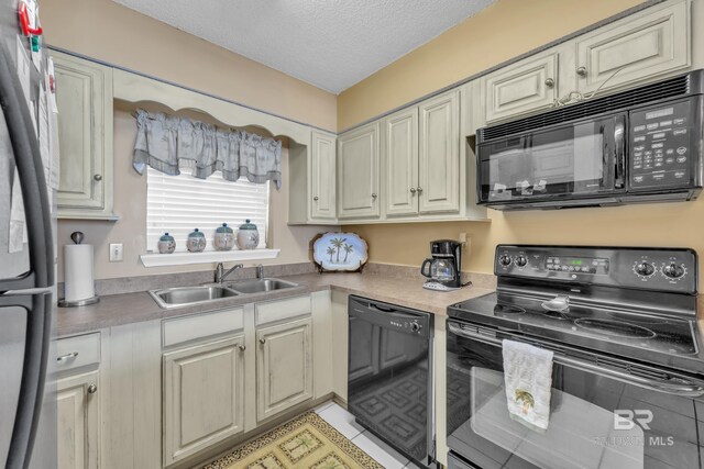 24522 Perdido Beach Blvd Unit 5617, Orange Beach, AL 36561 - kitchen featuring black appliances, a textured ceiling, and light countertops