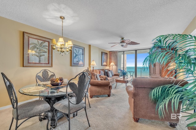 24522 Perdido Beach Blvd Unit 5617, Orange Beach, AL 36561 - dining space with a chandelier, a textured ceiling, light carpet, a ceiling fan, and a water view