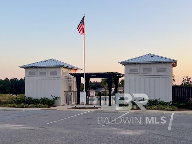 view of outdoor building at dusk