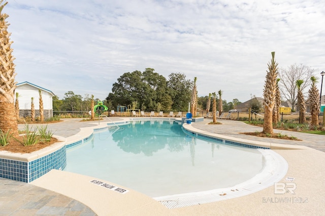 view of swimming pool featuring a patio area