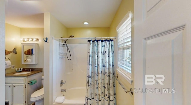 full bathroom featuring toilet, vanity, and shower / tub combo with curtain