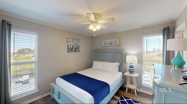 bedroom with ceiling fan, dark hardwood / wood-style flooring, and crown molding