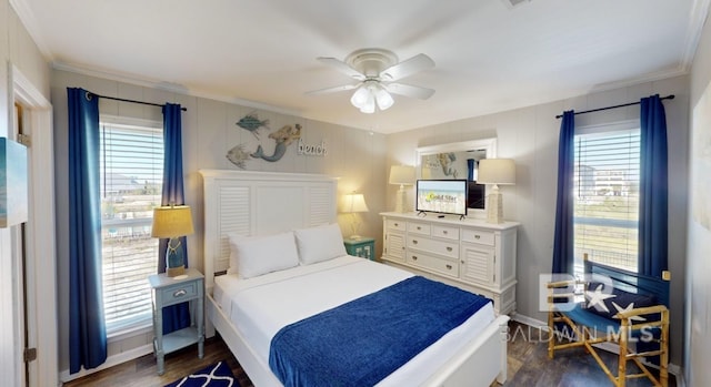 bedroom with ceiling fan, dark wood-type flooring, and crown molding