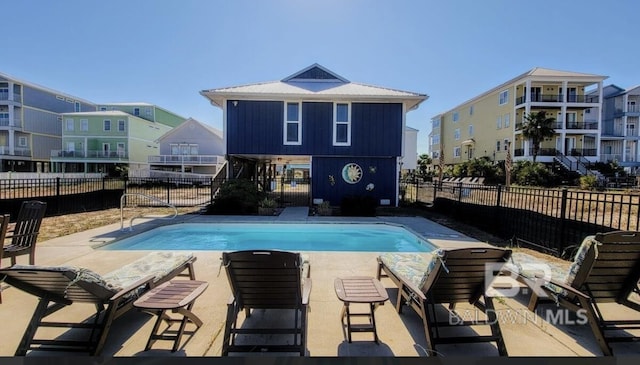 view of swimming pool featuring a patio area